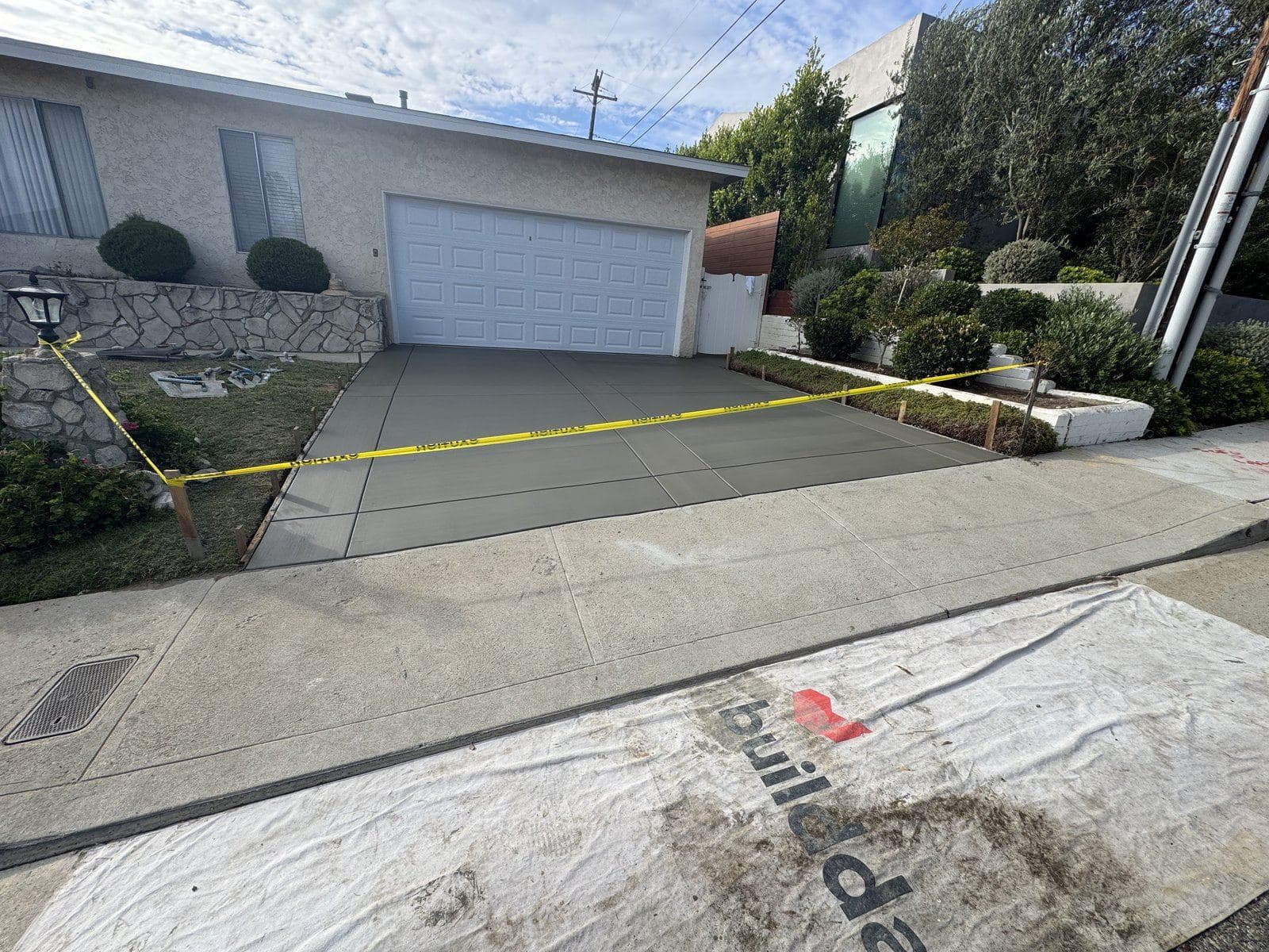 Finished concrete driveway on a Culver City home after a permitted Buildda driveway and drainage replacement
