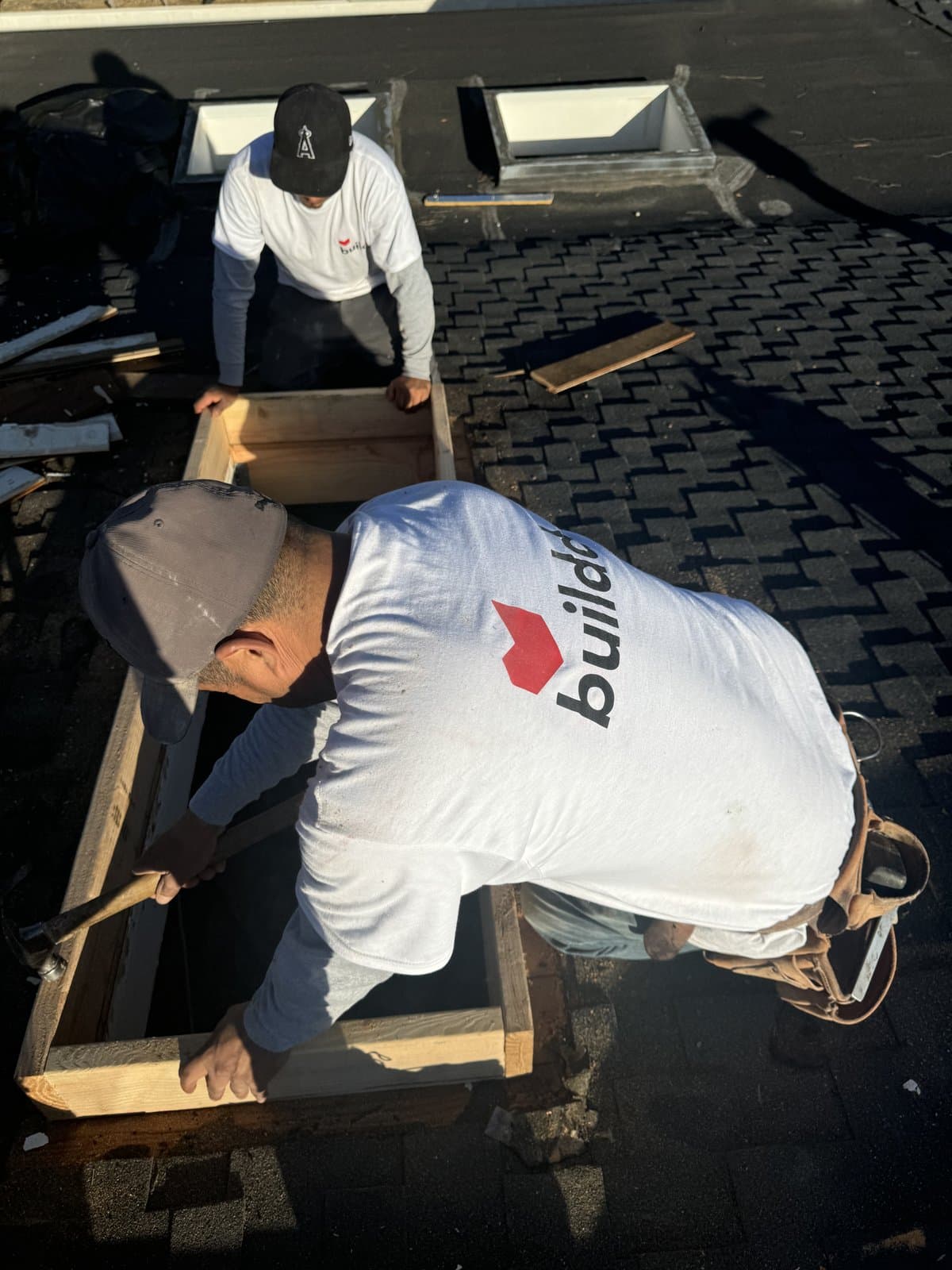Cutting skylight opening in roof deck during Brentwood project