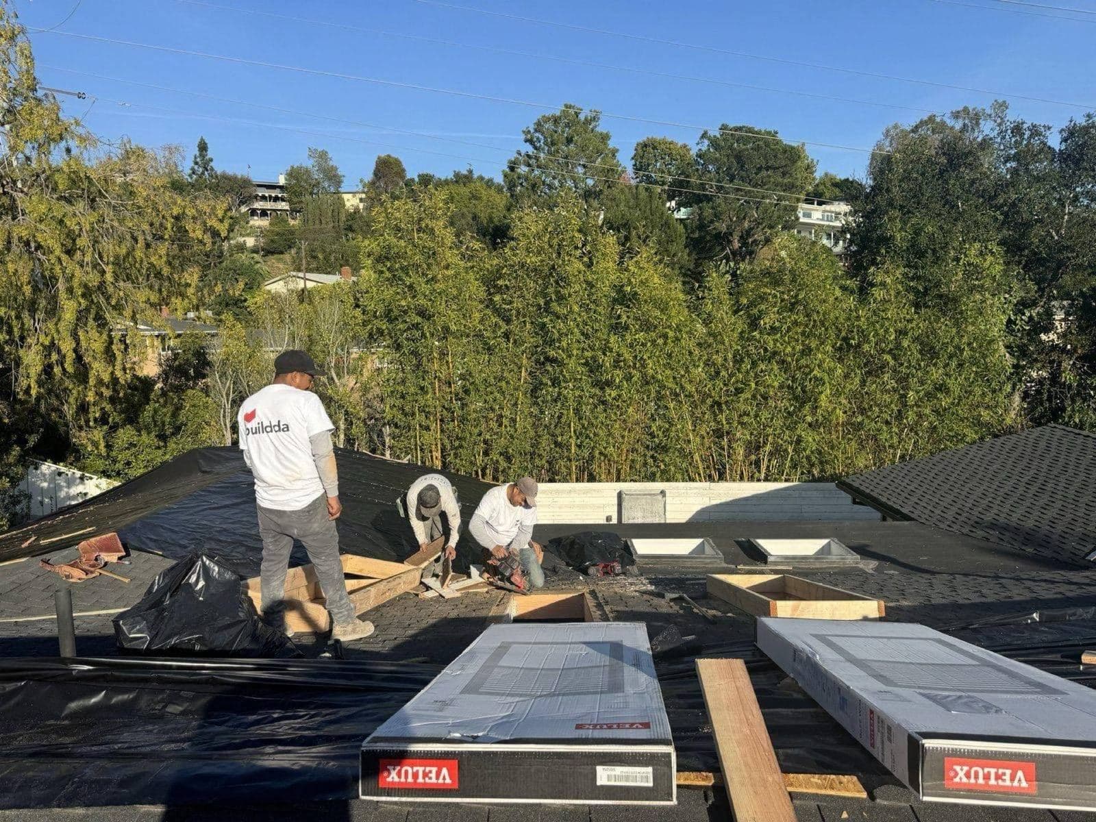 Velux skylights staged on underlayment during Brentwood roof replacement