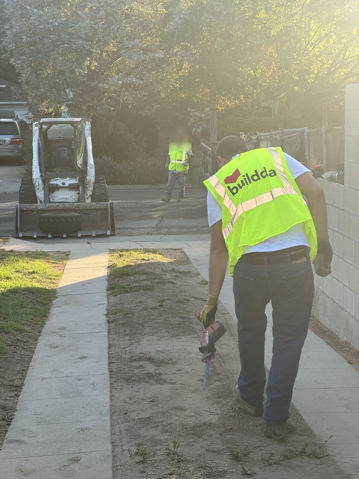 Old two-strip concrete driveway along the side of a Santa Monica home before Buildda replaced it